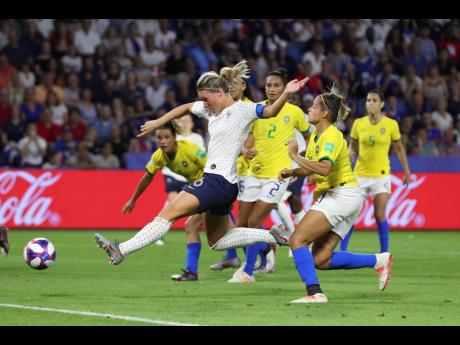 France’s Amandine Henry (second left) scores her side’s second goal during the FIFA Women’s World Cup round-of-16 match against Brazil at the Oceane Stadium in Le Havre, France, yesterday. 