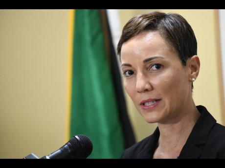 Minister of Foreign Affairs Kamina Johnson Smith addressing a press briefing at the ministry’s Dominica Drive offices in New Kingston yesterday.