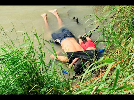 The bodies of Salvadoran migrant Oscar Alberto Martínez Ramírez and his nearly two-year-old daughter Valeria lie on the bank of the Rio Grande in Matamoros, Mexico, on Monday, after they drowned trying to cross the river to Brownsville, Texas. Martínez’ wife, Tania, told Mexican authorities she watched her husband and child disappear in the strong current. This photograph was first published in the Mexican newspaper, La Jornada. 