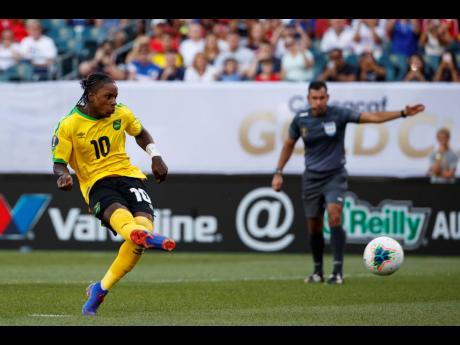 Jamaica’s Darren Mattocks scores his penalty kick to give the Reggae Boyz a 1-0 win over Panama during the second half of their Concacaf Gold Cup match at the Lincoln Financial Field in Philadelphia, Pennsylvania, yesterday. 