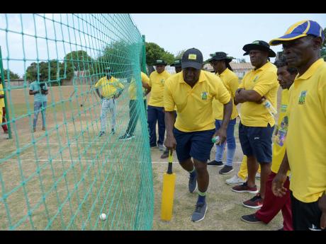 Wavell Hinds, former West Indies cricketer and president and CEO of the West Indies Players Association (WIPA),  goes through a demonstration exercise during a J. Wray and Nephew-sponsored WIPA coaching workshop at Kensington Cricket Oval on Wednesday, July 3.