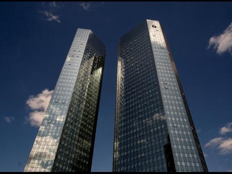Clouds reflected in the facade of the headquarters of Deutsche Bank in Frankfurt, Germany, on Monday, July 8, 2019.
