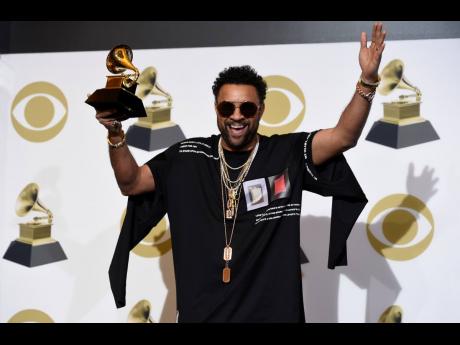 Shaggy poses in the press room with the award for Best Reggae Album for ‘44/876’ at the 61st annual Grammy Awards at the Staples Center on Sunday, February 10, 2019, in Los Angeles.