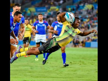 Jamaica Crocs’ Reinhardo ‘Rhino’ Richards scoring Jamaica’s lone try against Samoa in Commonwealth Games rugby sevens action on the Gold Coast, Australia, on Saturday, April 14, 2018. The Crocs went down 36-7.