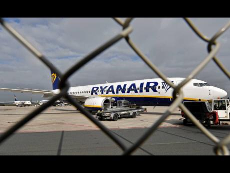 In this September 12, 2018 file photo, a Ryanair plane is parked at the airport in Weeze, Germany.