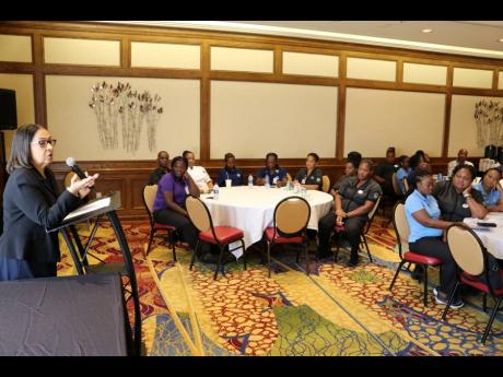 Minister of Labour and Social Security Shahine Robinson addresses Jamaican hotel workers at the Grand Traverse Hotel in Traverse City, Michigan, in the United States earlier this week.
