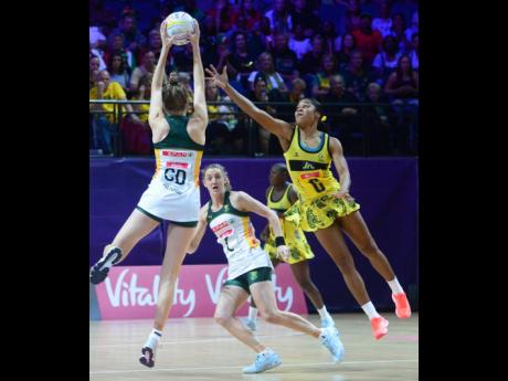 
Jamaica’s Adean Thomas (right) challenges for the ball as South Africa’s Karla Pretorius (GD) tries to pass it to her teammate, Erin Burger (C) during the 2019 Vitality Netball World Cup in Liverpool, England recently.