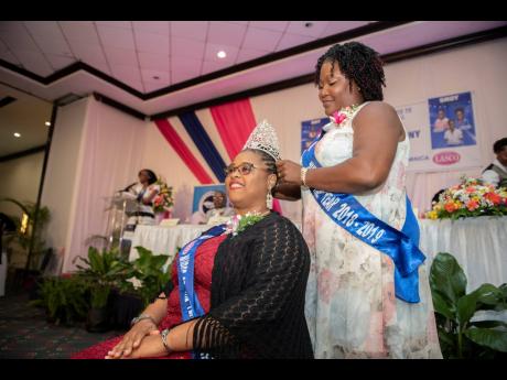 
Keisha Riley-Harrow is crowned the 2019-2020 Nurse of the Year by outgoing Nurse of the Year Denese Dacres-Reeves at the Nurses’ Association of Jamaica and LASCO National Nurse of the Year Awards held at The Jamaica Pegasus hotel in New Kingston yesterday.