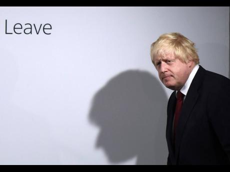 In this June 24, 2016 file photo, Vote Leave campaigner Boris Johnson arrives for a press conference at Vote Leave headquarters in London.