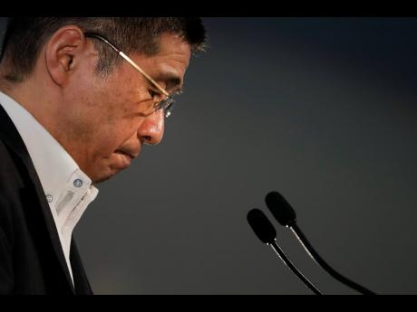 Nissan CEO Hiroto Saikawa pauses for a moment during a news conference at the global headquarters on Thursday, July 25, in Yokohama, west of Tokyo. 