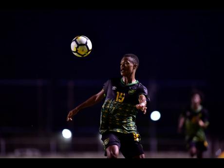 Jamaica Under-23 footballer Deshane Beckford in action against St Kitts and Nevis in their Olympic qualifying match at the Anthony Spaulding Sports Complex on Sunday, July 21. 