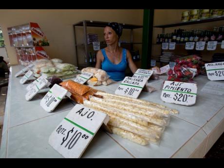 AP 
Roxana Lopez sell vegetables at a stall in Havana, Cuba, on Wednesday, July 31. 