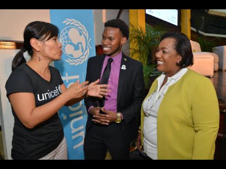 From left: Mariko Kagoshima, country representative for UNICEF, speaking with Matthew McHayle, chairman of the Child Protection & Family Services Agency’s (CPFSA) Children Advisory Panel, and Rosalee Gage-Grey, CPFSA CEO, during the launch of the National Children Summit 2019 at the Jamaica Conference Centre yesterday.