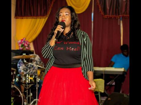 Garcianne Morrison during her delivery at the Soul Wounds Can Heal conference held last Saturday at the Church of God of Prophecy in Seaforth, St Thomas. 