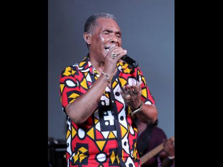 Veteran vocalist Ken Boothe holds a note during his performance at Jamaica Live. 