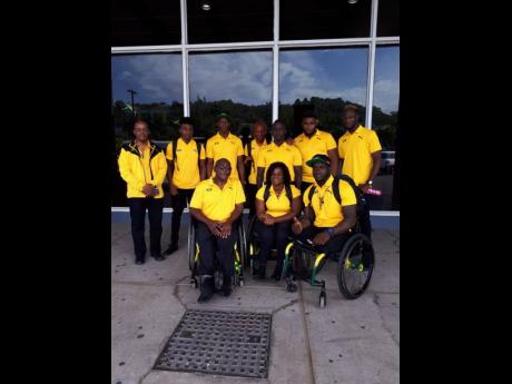 Members of the Para Pan Am delegation (seated from left) Neville Sinclair Sport Manager; Santana Campbell; and Navrado Griffiths (standing from left)  Dr Leroy Harrison, team doctor; Chadwick Campbell, team captain; Jason Brown; Tevaughn Thomas; Jason Ricketts; Theadore Subba; and Shane Hudson ahead of their departure to the games in Lima, Peru.