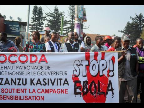 Residents march to raise awareness about Ebola, in the city of Goma, in eastern Congo Thursday, Aug. 22, 2019. Hundreds gathered in Goma to support Ebola response teams that have seen increasing attacks and resistance among communities where Ebola continues to spread after killing at least 1,800 people in the year since the outbreak began. (AP Photo/Justin Kabumba)