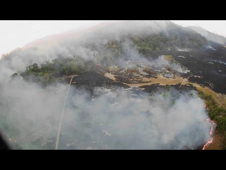 In this Aug. 20, 2019 drone photo released by the Corpo de Bombeiros de Mato Grosso, brush fires burn in Guaranta do Norte municipality, Mato Grosso state, Brazil. Brazil’s National Institute for Space Research, a federal agency monitoring deforestation and wildfires, said the country has seen a record number of wildfires this year. (Corpo de Bombeiros de Mato Grosso via AP)