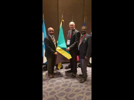 From left: Jamaica Paralympic Association (JPA) President Christopher Samuda, with Alberto Juantorena, president of the Cuban Paralympic Committee, and JPA director Randolph Jones at the Americas Paralympic Committee General Assembly in Lima, Peru.