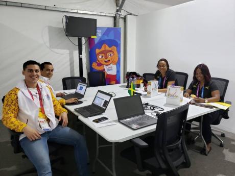 From left: Parapan Games volunteers Ivan Ugaz and Augusto Alvarez Calderan, Team Jamaica chef de mission Leonie Phinn, and administrative personnel Ann Marie Smith in their environs at the games in Lima, Peru.