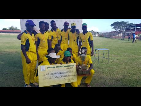 
St Mary celebrate with their trophy and winners cheque of $500,000 for victory over St Ann in the final of the Jamaica Cricket Association Limited Overs Competition at Chedwin Park, St Catherine, yesterday. 