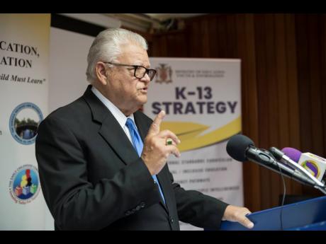 Minister of Education Karl Samuda speaks at the Ministry of Education’s annual back-to-school press briefing yesterday.
