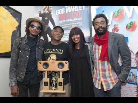 The No-Maddz members Sheldon Sheperd (left) and Everaldo ‘Evie’ Creary (right) stand with Clive ‘Busy’ Campbell and Shantell Hill.