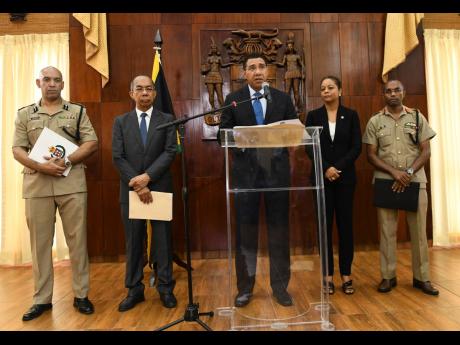 From left: Commissioner of Police Major General Antony Anderson, Minister of National Security Dr Horace Chang, Prime Minister Andrew Holness, Attorney General Marlene Malahoo-Forte, and Chief of Defence Staff Lieutenant General Rocky Meade at the Jamaica House announcement of a state of public emergency being imposed in Clarendon and St Catherine yesterday.