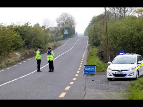 In this May 12, 2017 file photo, police officers patrol the Irish border.