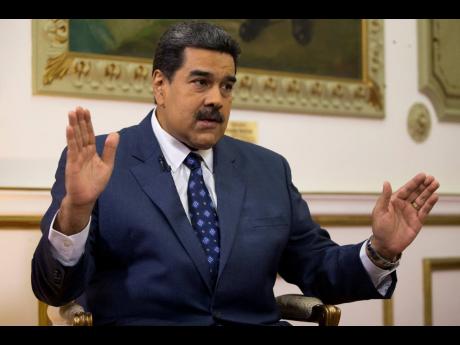 Venezuela’s President Nicolas Maduro speaks during an interview with The Associated Press at Miraflores presidential palace in Caracas, Venezuela. Maduro ordered on Tuesday, September 3. Venezuela’s military to hold exercises along the border with Colombia. 