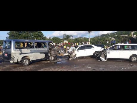 The three vehicles involved in the accident along the Flankers main road in St James yesterday. The driver of the middle vehicle died on the spot. The bus driver succumbed to his injuries at hospital. 