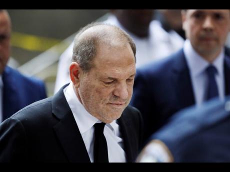 In this Aug. 26, 2019, photo, Harvey Weinstein arrives in court in New York. A new book by The New York Times reporters who uncovered sexual misconduct accusations against Weinstein includes new details on the movie mogul’s attempts to stop the newspaper from publishing the story. (AP Photo/Mark Lennihan)
