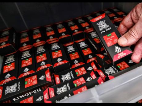 This Wednesday, August 28, 2019  photo shows a bin of Kingpen packaging sold at a wholesale vape shop in downtown Los Angeles. Bootleggers eager to profit off unsuspecting consumers are mimicking popular vape brands, pairing replica packaging churned out in Chinese factories with untested, and possibly adulterated, cannabis oil produced in the state’s vast underground market. 