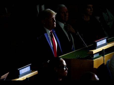 President Donald Trump listens during the United Nations Climate Action Summit during the General Assembly yesterday in New York. (AP)