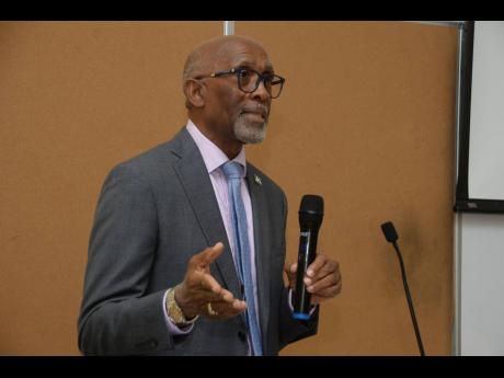 Carlton Earl Samuels, chief development financing officer of the Jamaica National Group, addressing students at the University of Technology recently.