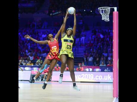 Jamaica’s Jhaniele Fowler (right) outjumps Uganda’s Muhayimina Namuwaya to collect a pass during the Netball World Cup at the M&S Bank Arena in Liverpool on Thursday, July 18, 2019.  