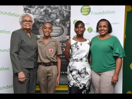 The Granville Marsh awardees, Kyle Mignott and Yemisi Rowe, are pictured alongside the family of the late Granville Marsh – Claudette Marsh and Kerry Marsh – who presented them with this special award.