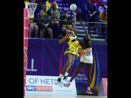 Jamaica senior netball team captain Jhaniele Fowler (left) goes high for a ball against South Africa’s Phumza Maweni during their Netball World Cup match at the M&S Bank Arena in Liverpool, England, on Sunday, July 14, 2019.