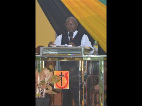 Bishop Ralston Powell, pastor of the Glendevon New Testament Church of God in Montego Bay, St James, delivering the keynote sermon during the annual Heritage Week thanksgiving service at his church yesterday.