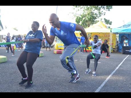 Fit 4 Life's Brand Ambassador Dr Alfred Dawes shows the resistance band sprint what beast mode means while on the back to basics circuit
