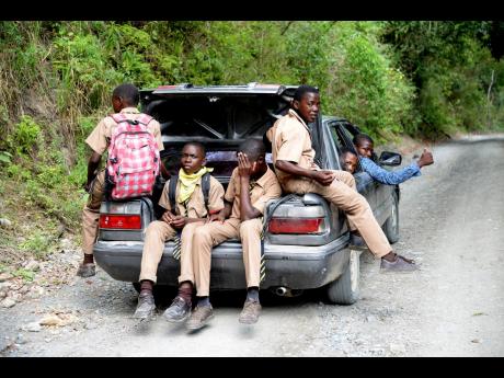 The shortage of public transportation in St Thomas forces students to use dangerous means to travel to school.