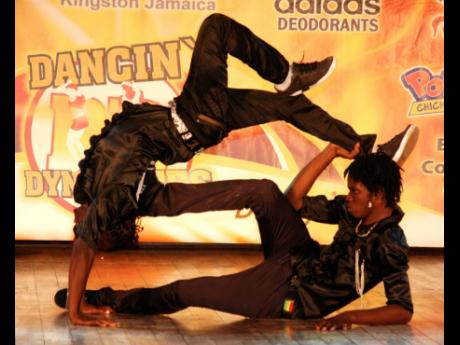 In this March 2011 file photo, two local break dancers display their skills in competition during an episode of Television Jamaica’s Dancing Dynamites.