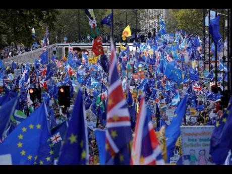 
Supporters of Britain remaining in the European Union take part in a ‘People’s Vote’ protest march calling for another referendum on Britain’s EU membership, in London.