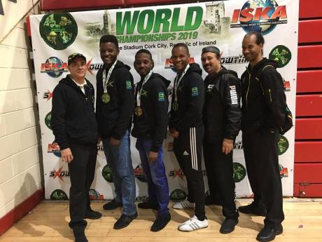 Jamaica’s delegation to the 2019 International Sports Kickboxing Association Amateur Associations World Championships. (From left) Coach Claude Chin; fighters Richard Stone, Ackeem Lawrence, Nicholas Dusard; coach Jason McKay, and referee Alvin Bernard.