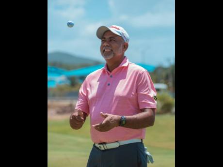Sean Morris celebrates topping the JGA Heroes Weekend Golf Classic on Saturday at the Caymanas Golf Club. He defeated Mark Newnham by just one stroke at the end of the two-day tournament, which started at the Constant Spring Golf Club.