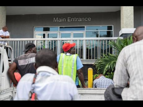 Drivers await prospective clients at Kingston Wharves Limited’s Total Logistics Facility located at 195 Second Street, Newport West, Kingston. The facility’s operational efficiency was criticised by persons conducting business, with an outcry over long wait times. 