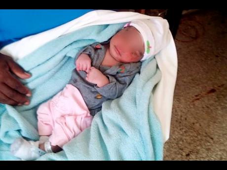 Baby Moses, the newborn rescued from an outdoor toilet in Cox Piece, St Mary, last Thursday.