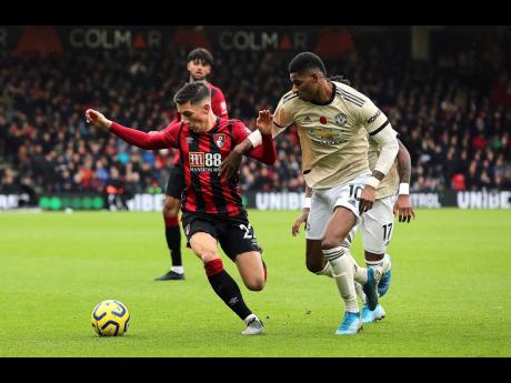 
Bournemouth’s Harry Wilson (left) and Manchester United’s Marcus Rashford battle for the ball during the English Premiership match at The Vitality Stadium, Bournemouth, England, yesterday. Bournemouth won 1-0.