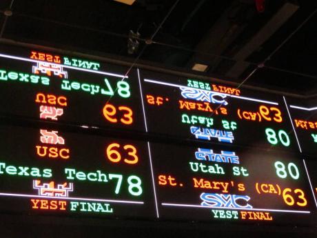 This November 20, 2018 file photo shows a scrolling video board with basketball scores reflected in the ceiling of the new sports book at Resorts Casino in Atlantic City, New Jersey.