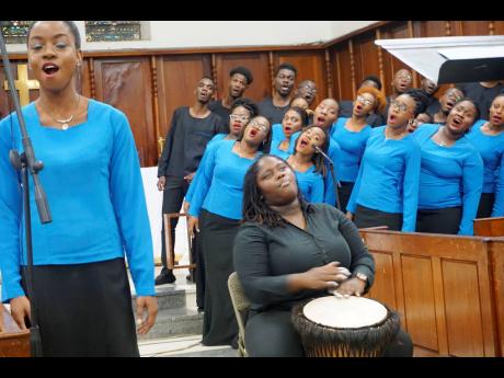 Soloist Dominique Campbell and percussionist Nora-Gaye Banton with other members of the University Chorale perform during ‘Eclectic Roots Fall Chapel Concert at the University Chapel, Mona, last Sunday, November 3, 2019.